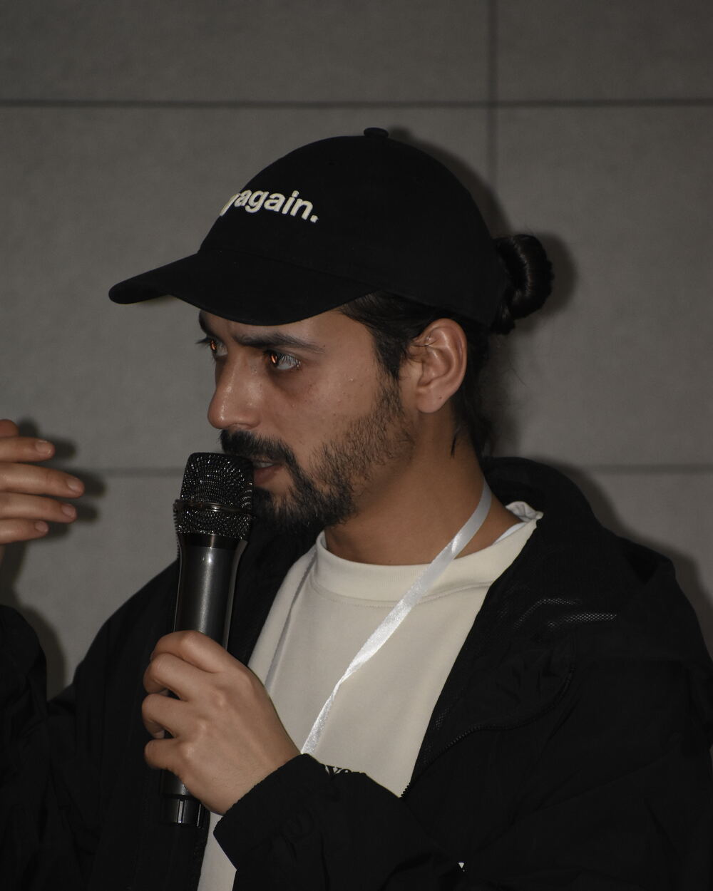 Raslem answering a question from the room during a workshop